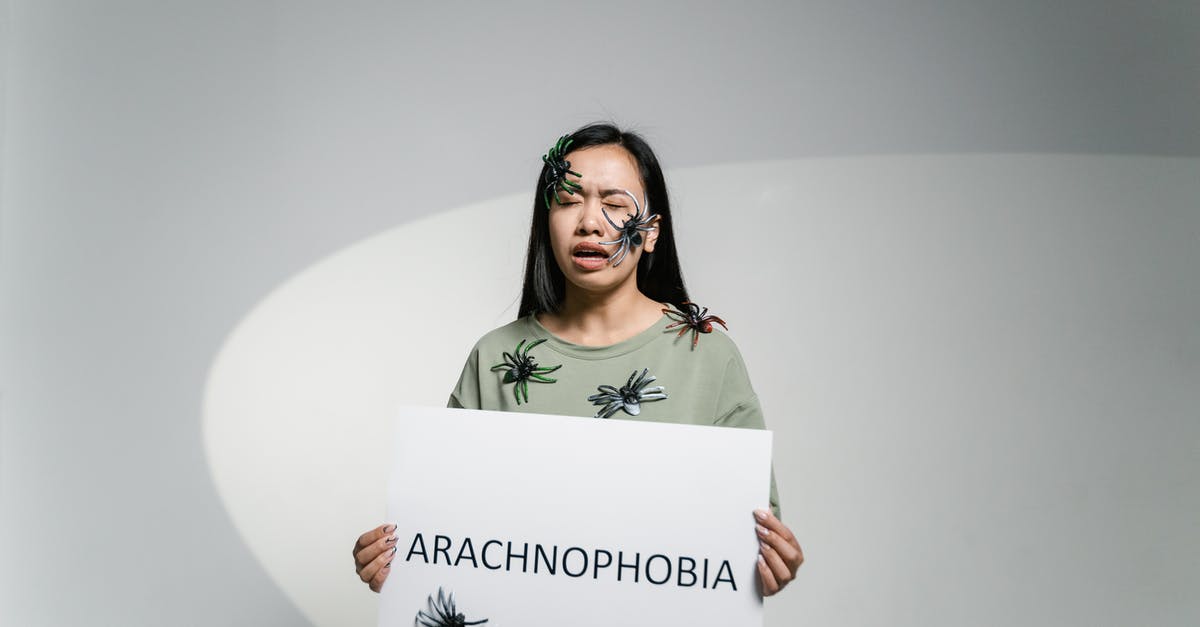 Question about spiders in Arachnophobia - A Fearful Woman Holding a Sign of Arachnophobia