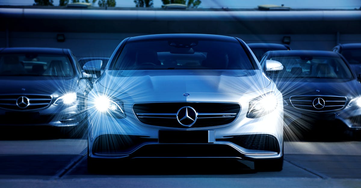 Reference for 'headlight eyes' in Cars 2? - White Mercedes Benz Cars