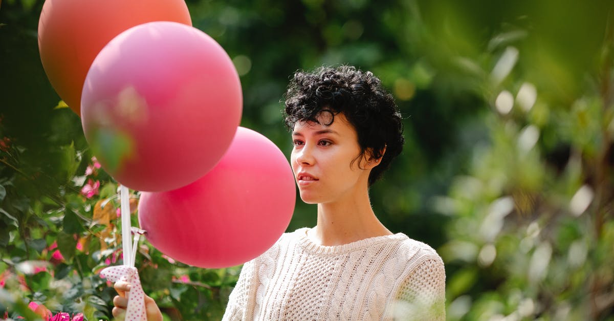 Regarding The Hunger Games' festive environment - Content woman with colorful balloons