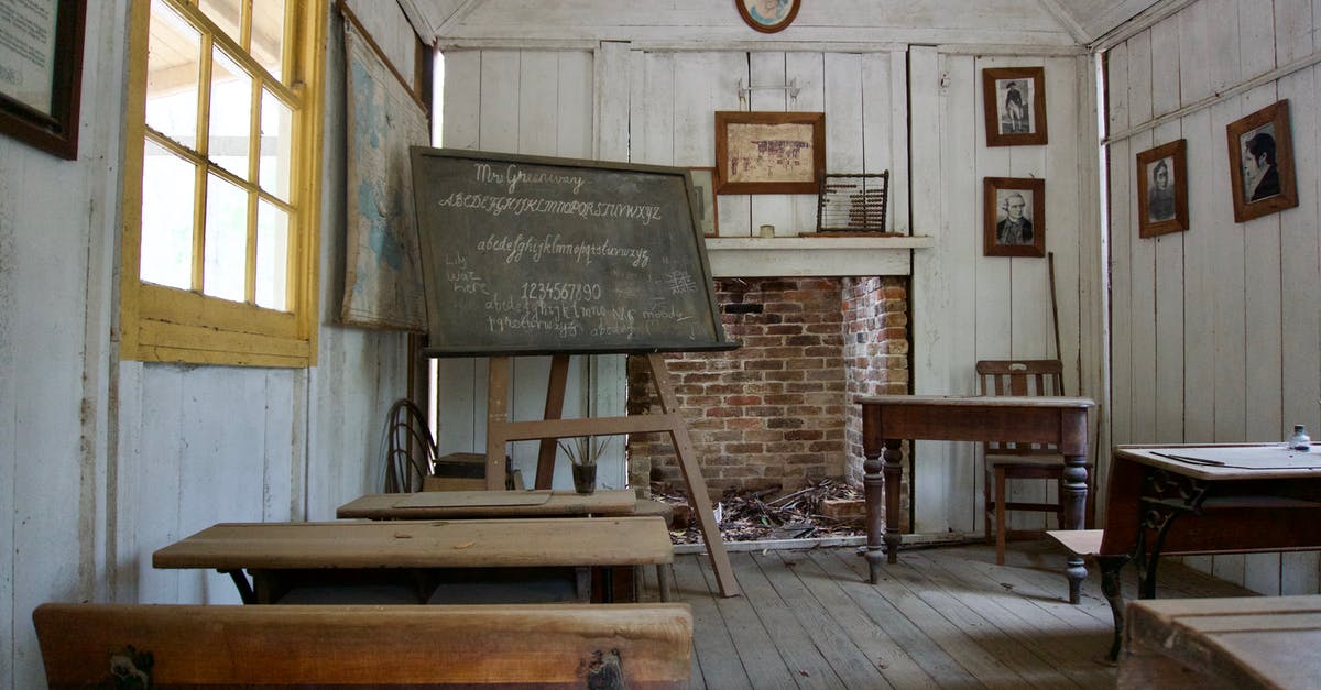 School Custodian as All-Knowing Insider - Brown Wooden Desk Table