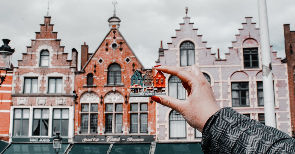 Shouldn't the building keep its same weight? [duplicate] - Person Holding Miniature House Toy Comparing on Real Building