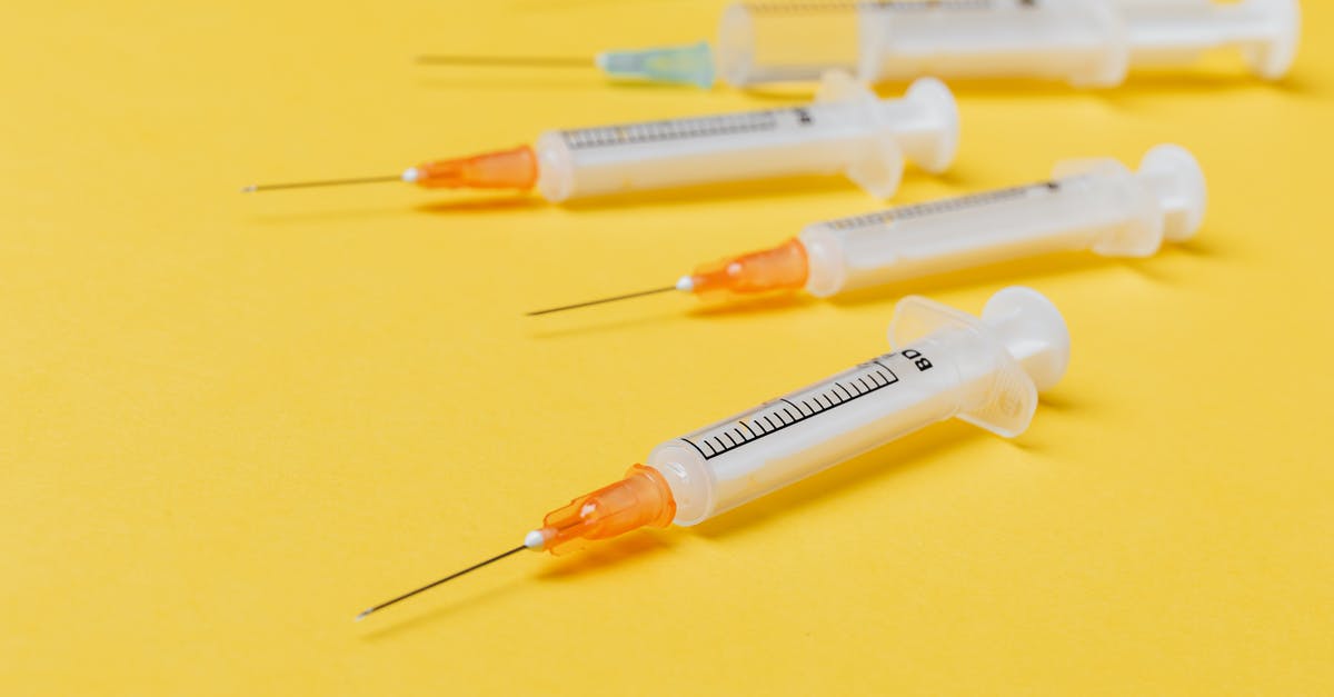 Significance of psychedelic drug use in Bacurau - Syringe injectors placed on yellow surface