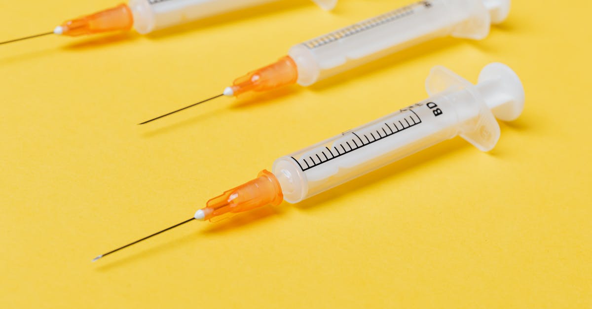 Significance of psychedelic drug use in Bacurau - Empty syringe injectors on yellow background
