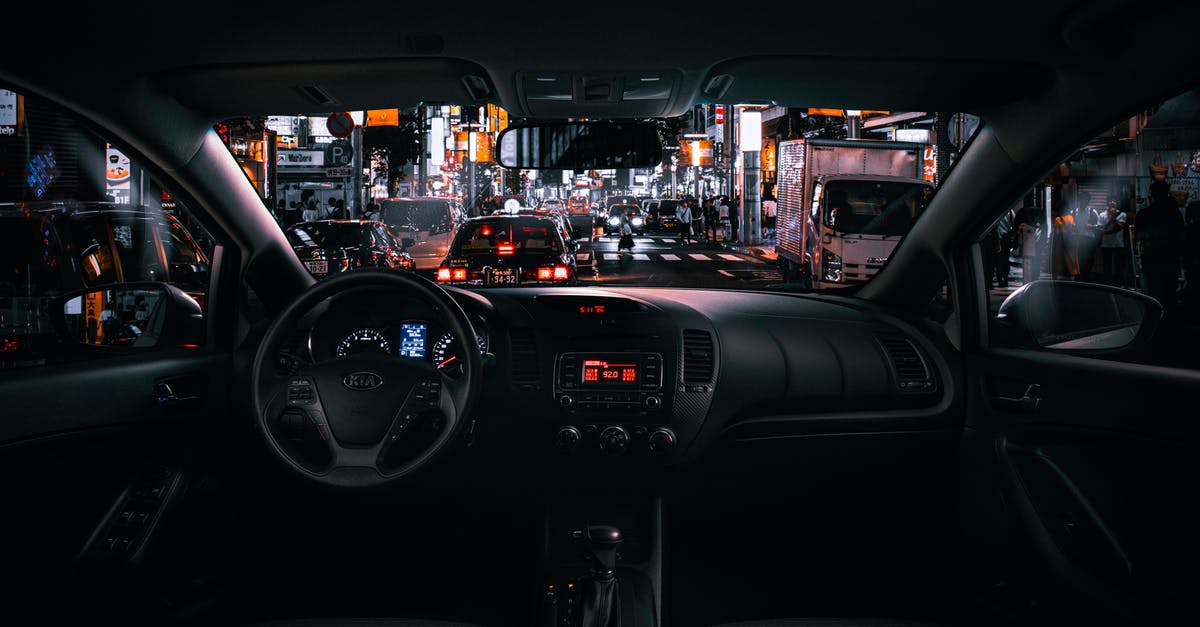 Steering in Flip Cars - Black Car Steering Wheel and Interior during Night Time