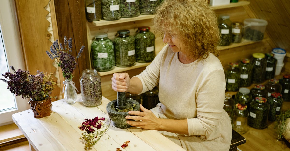 Stock Footage of Alan Shepard in The Right Stuff? - Woman Making Herbs in Pounder