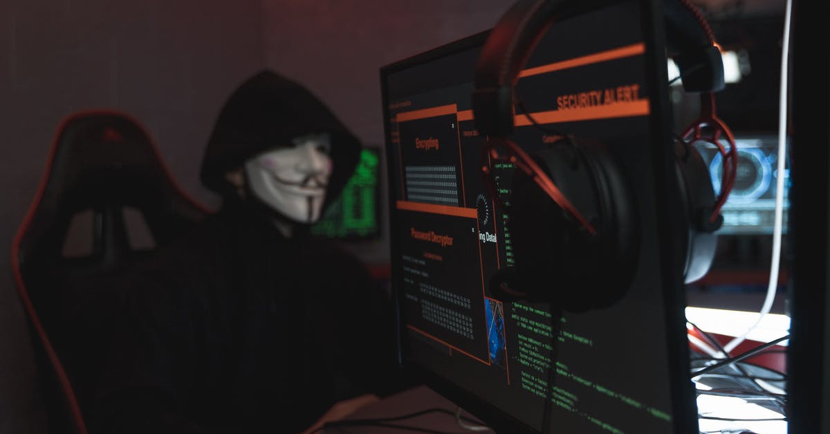 Submarine crew fakes a software/virus-initiated missile attack to trick bad guy programmer into revealing the abort code [closed] - Person in Black Hoodie Hacking a Computer System
