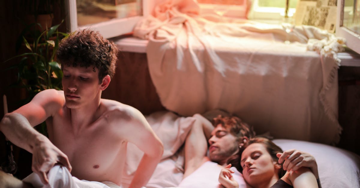 The cheque in The Dreamers - Topless Man Lying on Bed Beside Girl and Boy