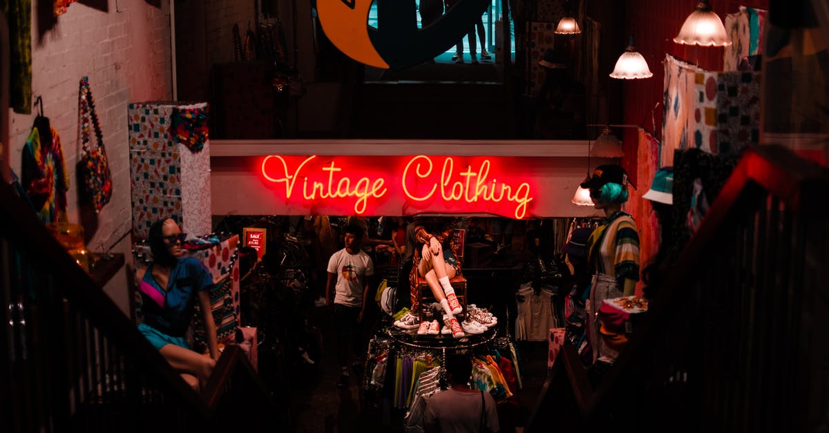 The choice to switch from POV in the remake of 'Maniac' - Neon sign in shop with vintage clothes