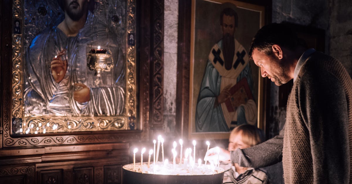 The Khan says "You men of God retreat, this boy advances..." - Father and Son Lighting Candles