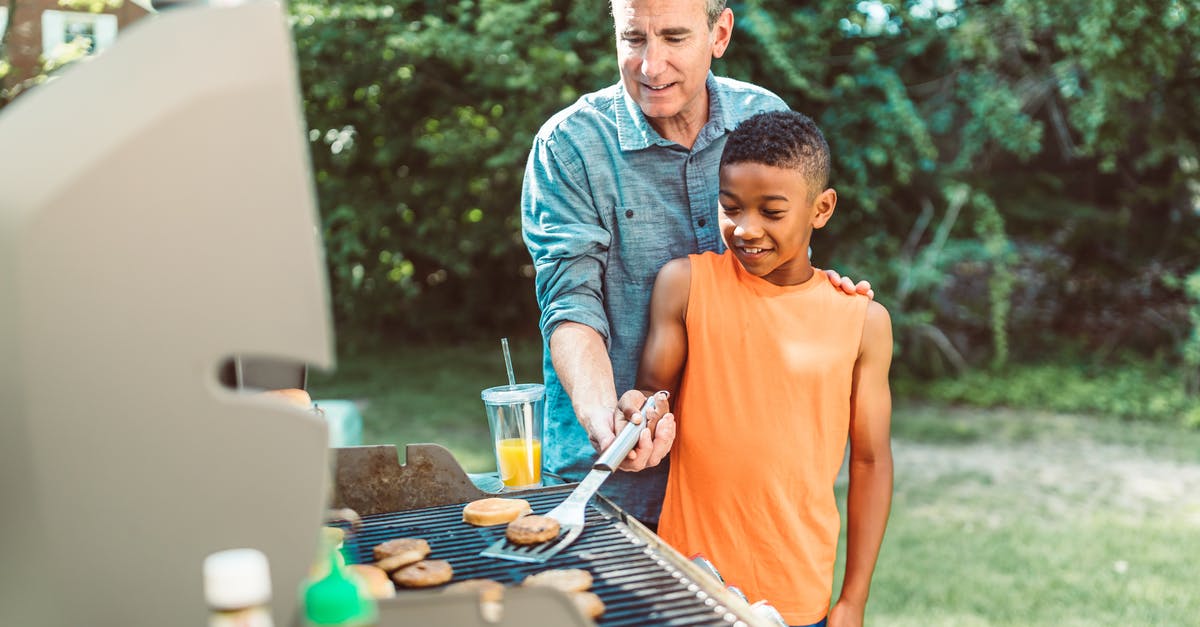 The meaning of the adopted African boy in Fargo? - A Father Teaching His Son How to Cook Hamburgers