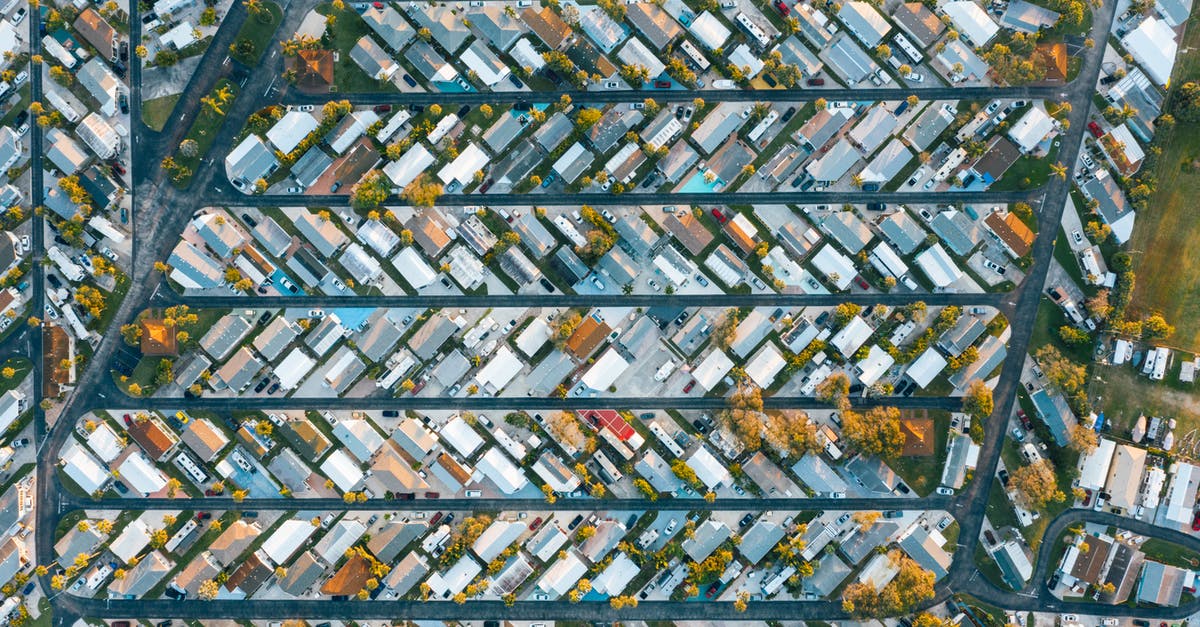 The plan in Arlington Road - Drone view of modern buildings located in rows between roads in suburb of contemporary town on daytime