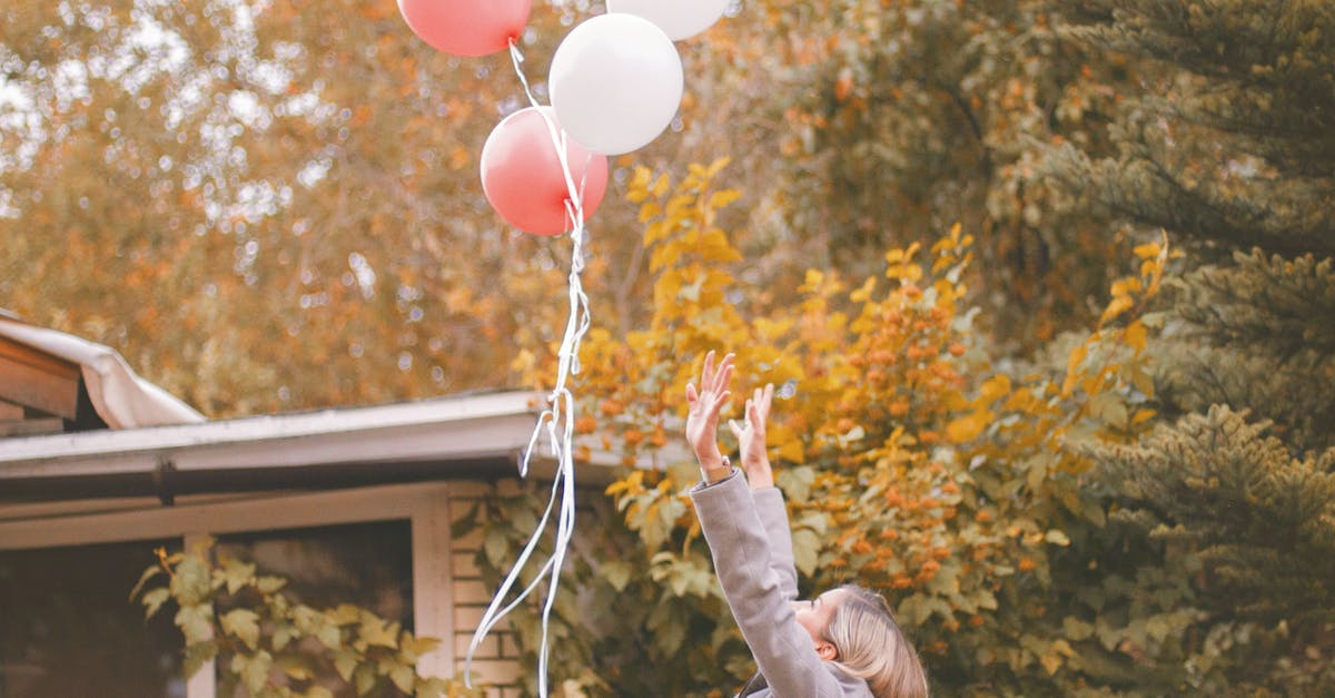 Theatrical Release vs Home Release Differences - Woman in Gray Jacket Released Balloons in the Air