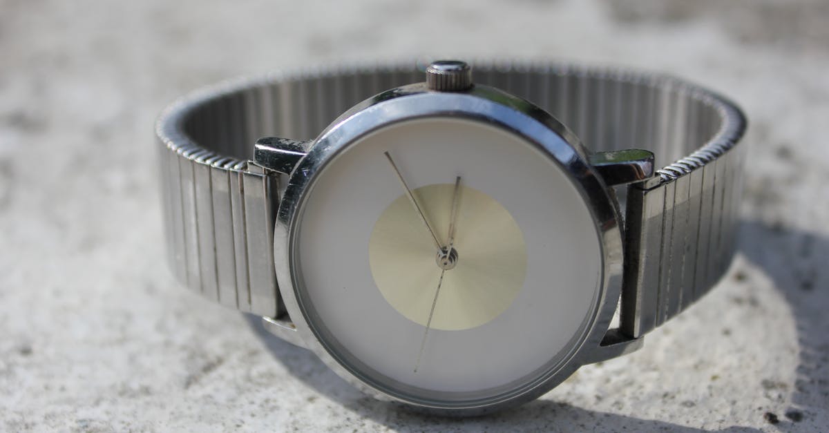 Time travel movie with a spinning time machine [closed] - Silver-colored Analog Watch