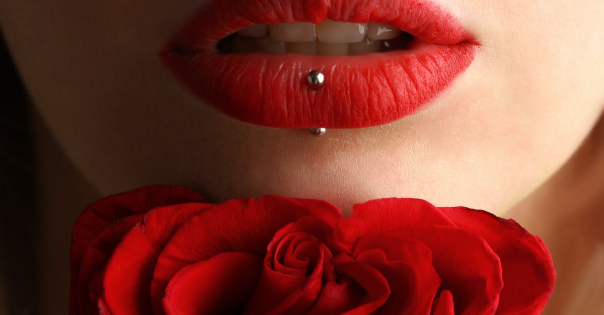 Town infested with alien parasites causing people to lose their teeth [closed] - Woman Wearing Red Lipstick Near Red Rose