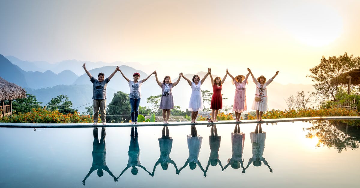 TV-Show: Time travel with group of different times. Fork-like tool used as weapon [closed] - Group of happy people in colorful summer clothes raising hands and enjoying nature spending holidays together