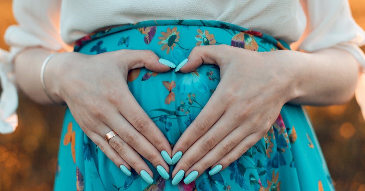 Was any further information on Margaret's pregnancy ever given? - Woman Making a Heart with Her Hands on Her Pregnant Belly 