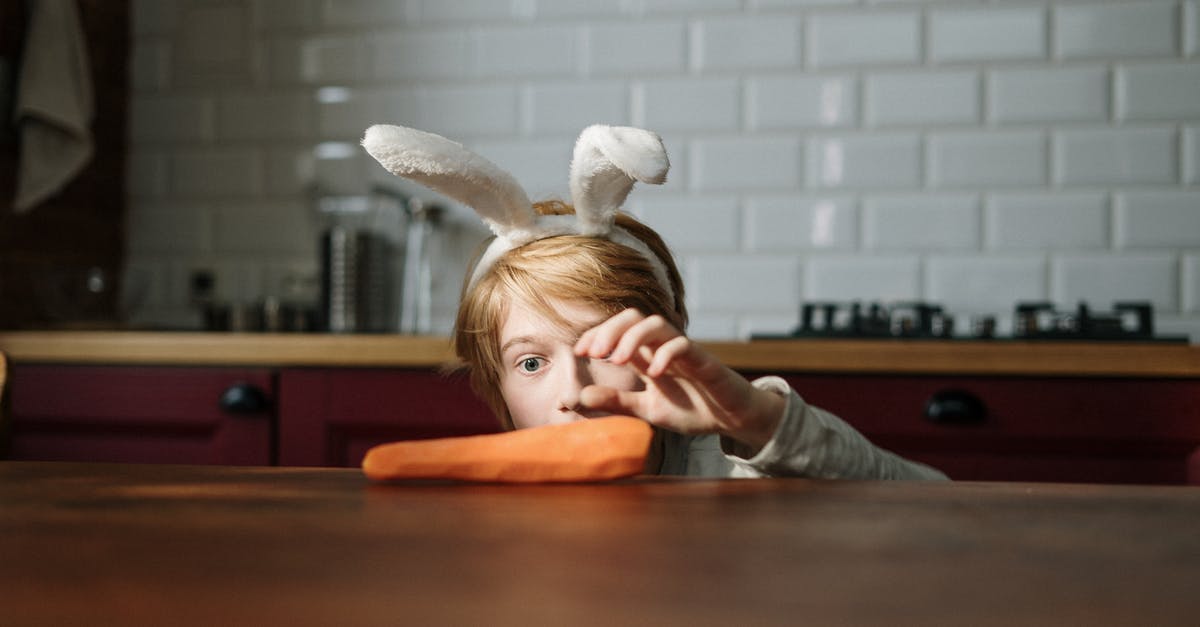Was Bugs Bunny impersonating someone when he ate the carrot? - Boy Grabbing Carrot on the Table