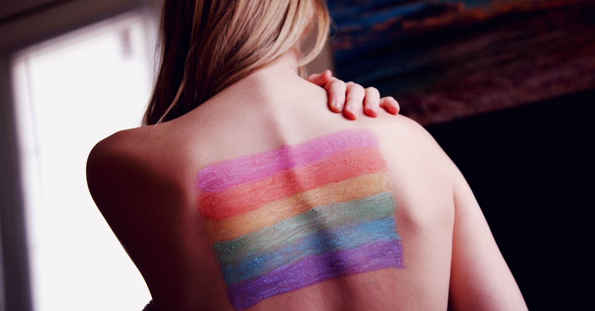 Was it that easy to fake identities back in the 1950s? - Woman With a Gay Pride Body Paint on Back