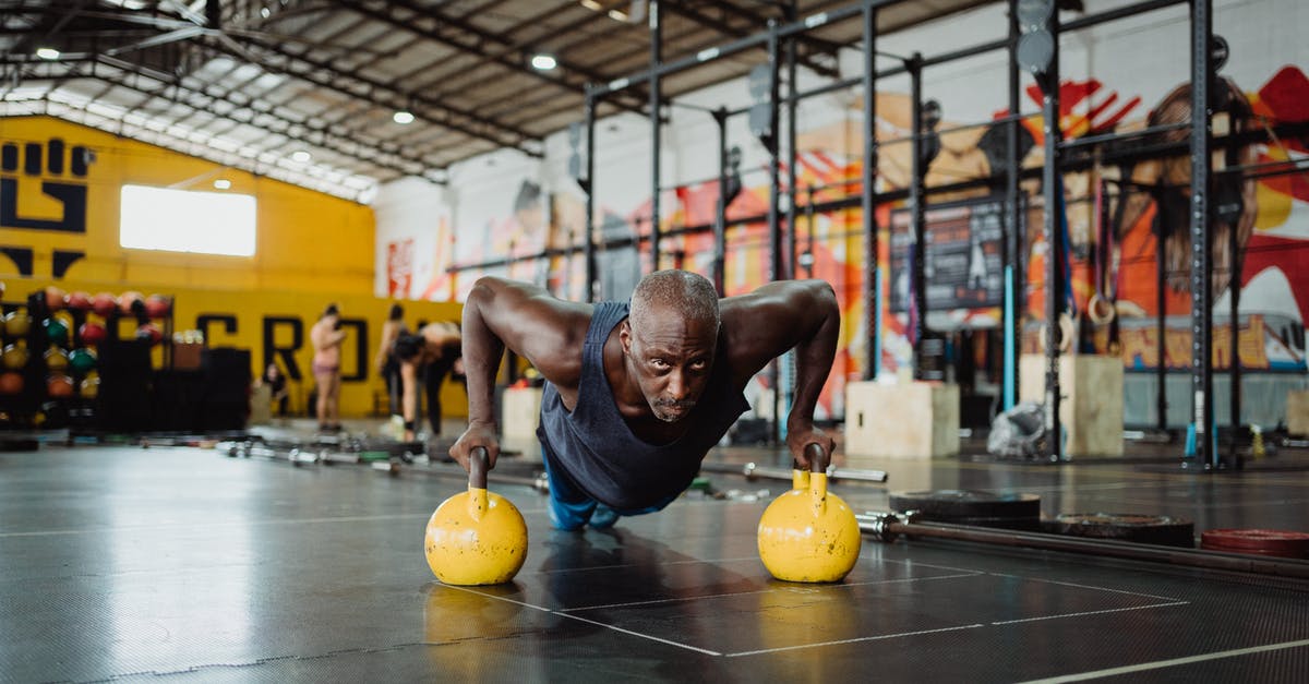 Was Nullah being derogatory when using the J-word in Australia? - Photo of Man Doing Push-Ups Using Yellow Kettlebell
