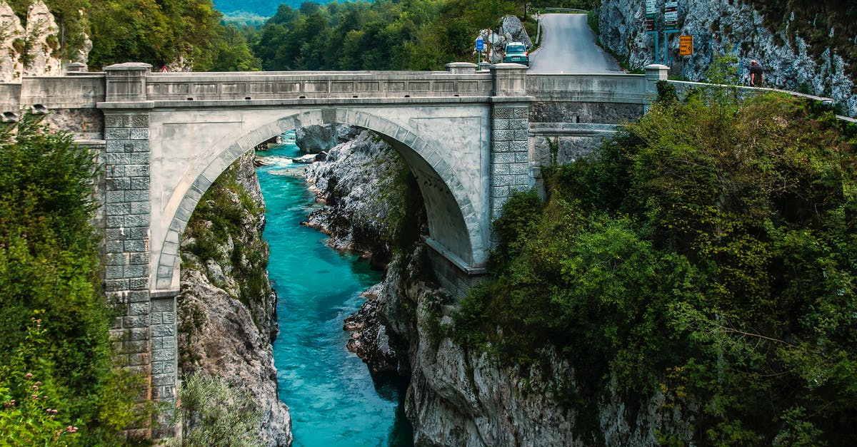 Was Odin the reason Thanos never collected the stones personally? - Concrete Bridge over Clear Blue River Beside Mountain