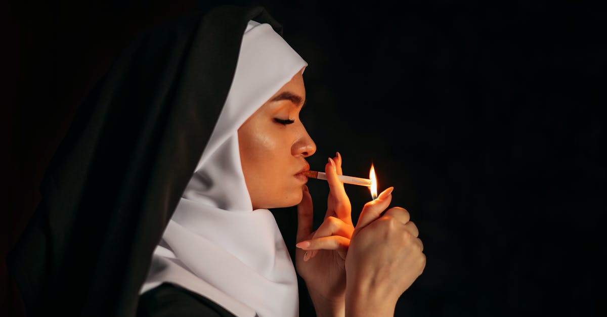 Was the nun really the mother? - A Woman with Black and White Head Scarf Lighting Up a Cigarette