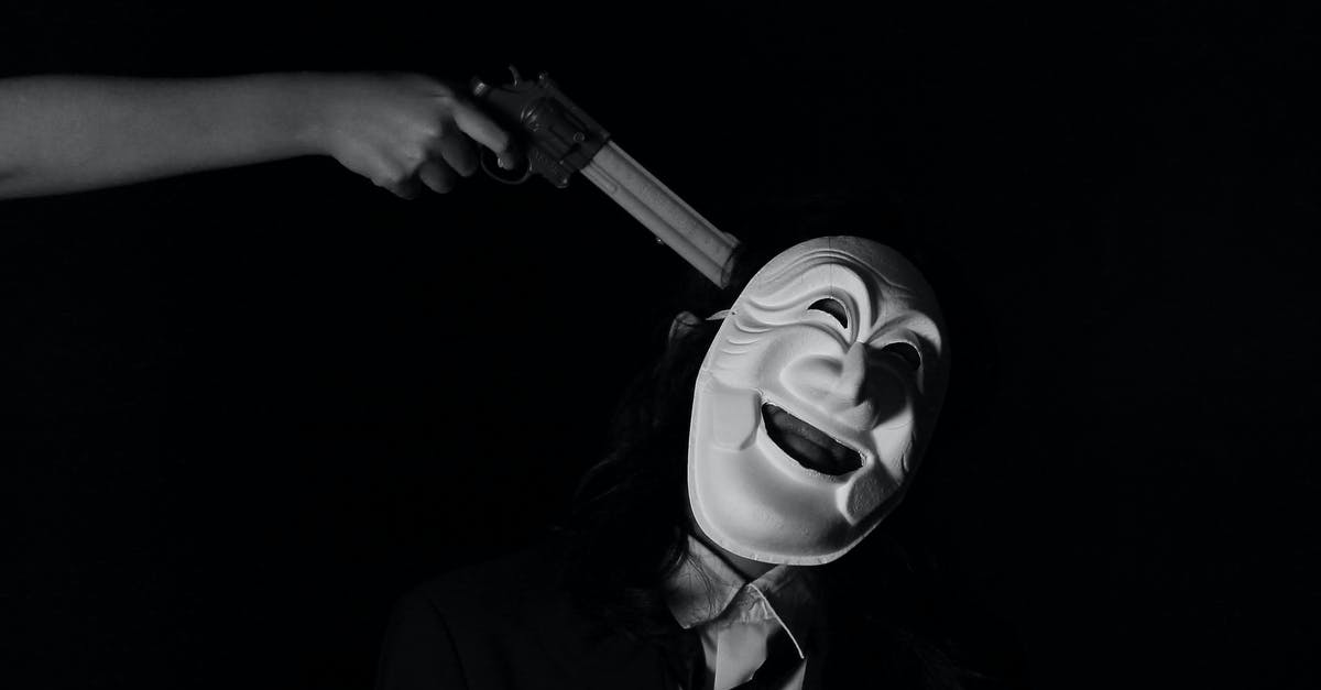 Was this predatorial villain original to the movie? - Grayscale Photo of Person Holding a Gun