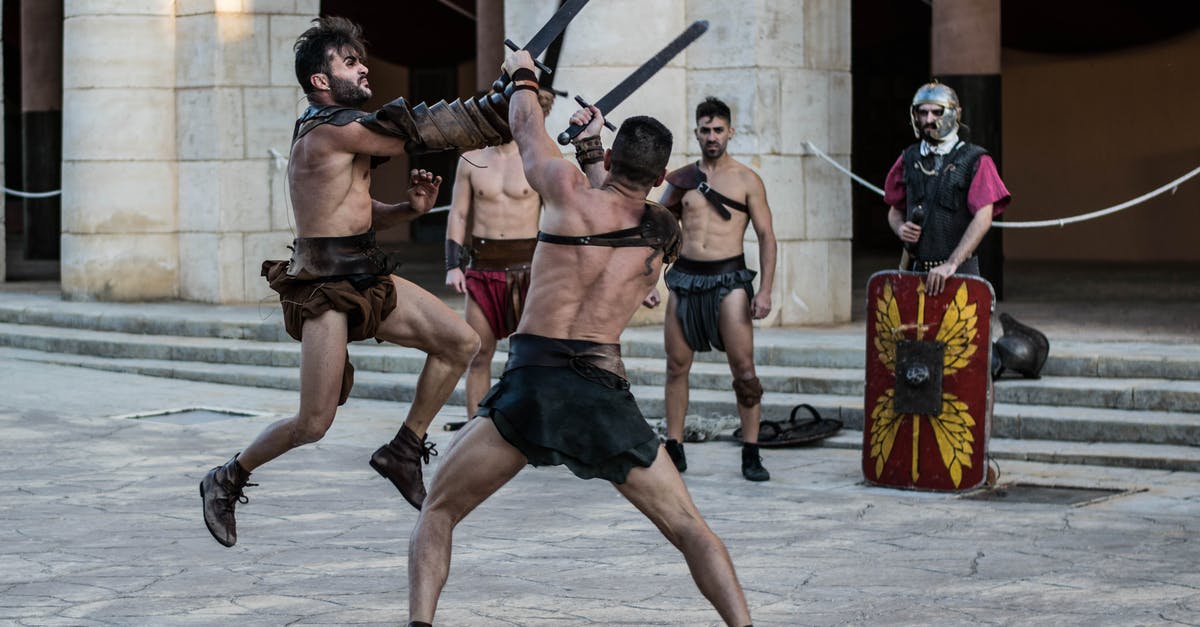 Were gladiators forced to fight in historical reenactments, as they did in "Gladiator"? - Shirtless Men Fighting with Sword