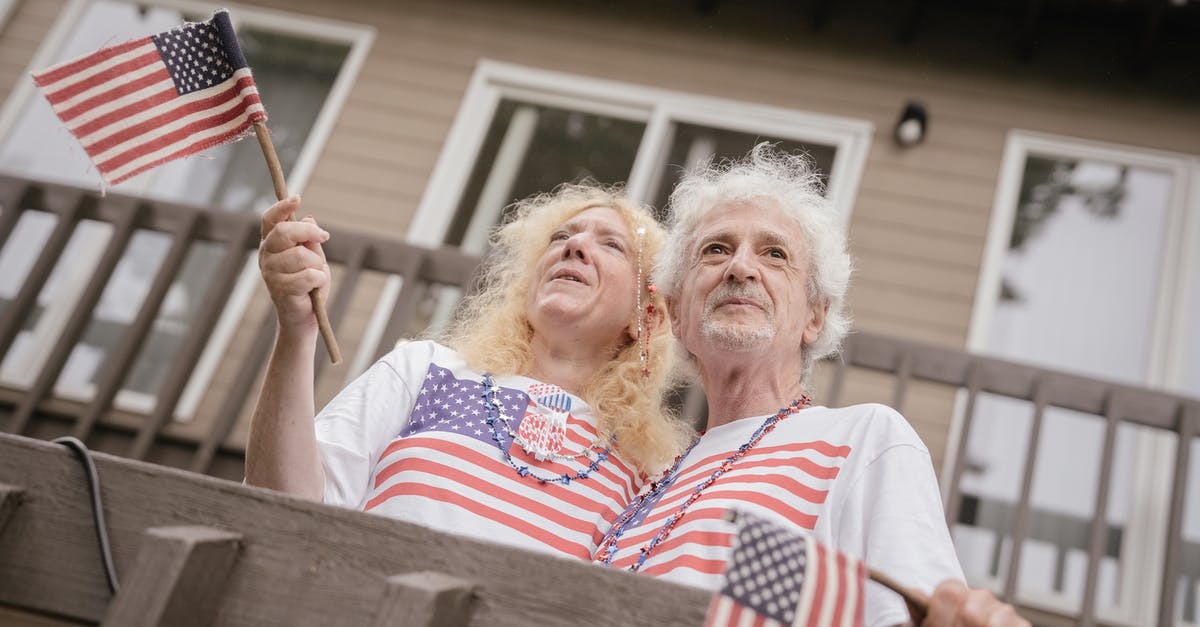 Were Kruger and his men Elysium citizens? - An Elderly Couple Holding American Flags