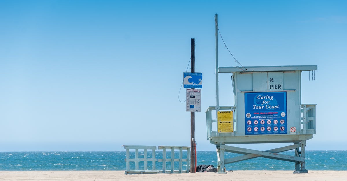 Were there early signs Pat liked Kat? - Blue Wooden Lifeguard Tower on Beach