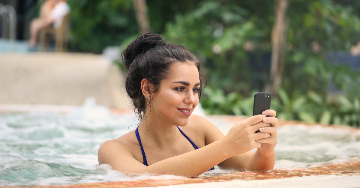 Wet Hot American Summer movie and TV show question - Photo of a Woman in Jacuzzi Using Smartphone