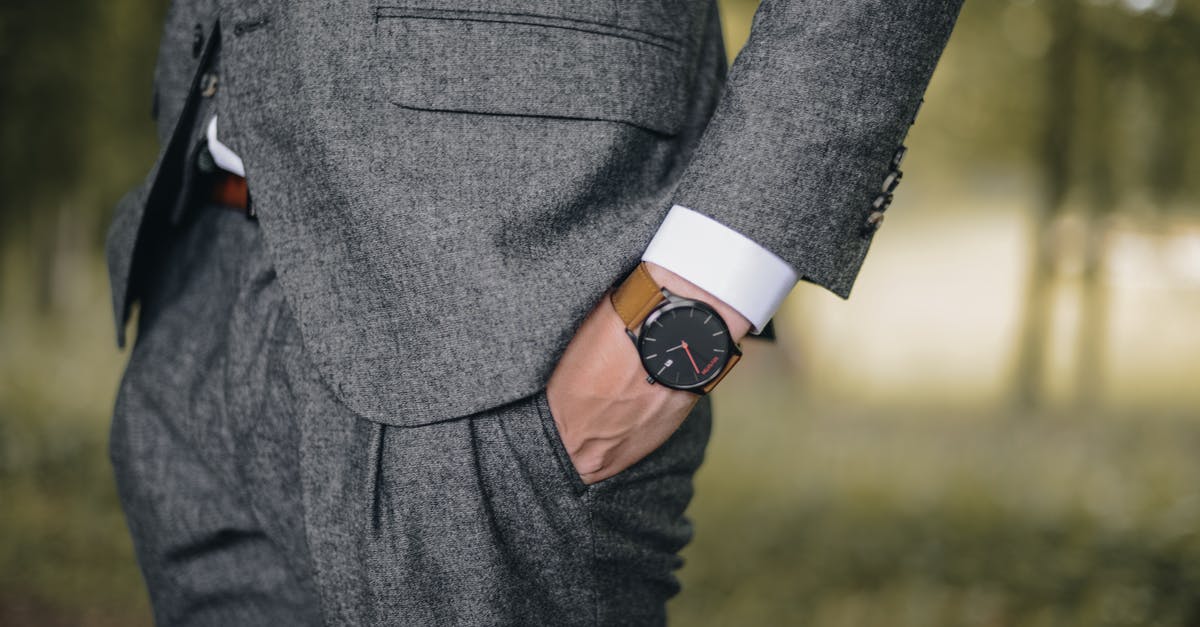 What's going on with the watch? - Man Wearing Watch With Hand on Pocket
