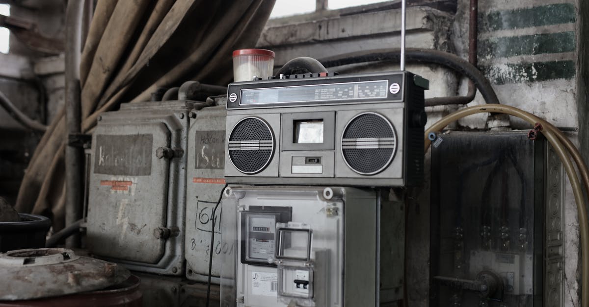 What's the metal clinking sound at the end of credits in Avengers: Endgame? - Old fashioned cassette player placed in shabby garage near old industrial equipment