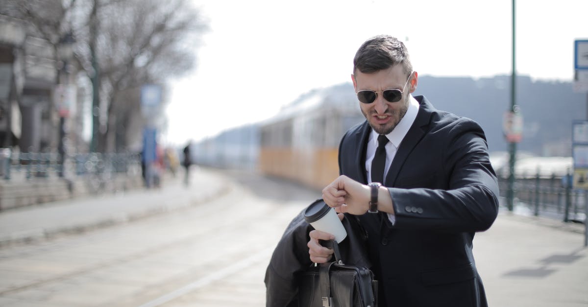 What's the rush to travel forward in time? - Man in Black Suit Jacket Holding Black Leather Bag