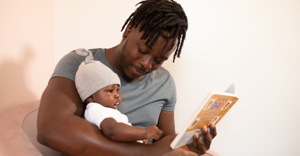 What's the significance of the book Bonnie is reading? - Man in Gray Shirt Holding Baby in White Onesie
