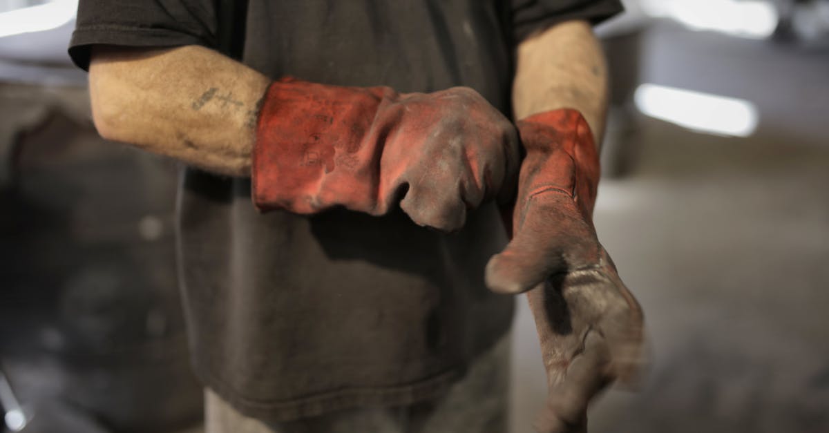 What's the term and production process for a teaser consisting of clips from the show? - From above of crop male fitter in shabby heavy duty gloves in workshop