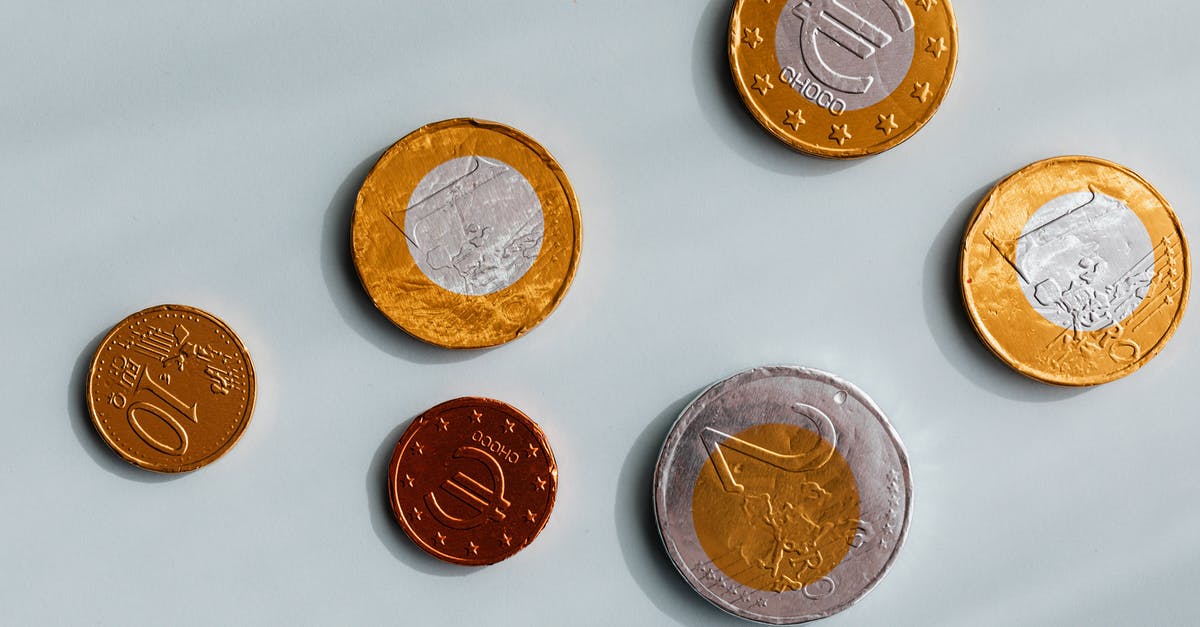 What's the value of the John Wick gold coins? - Currency of European Union on marble surface