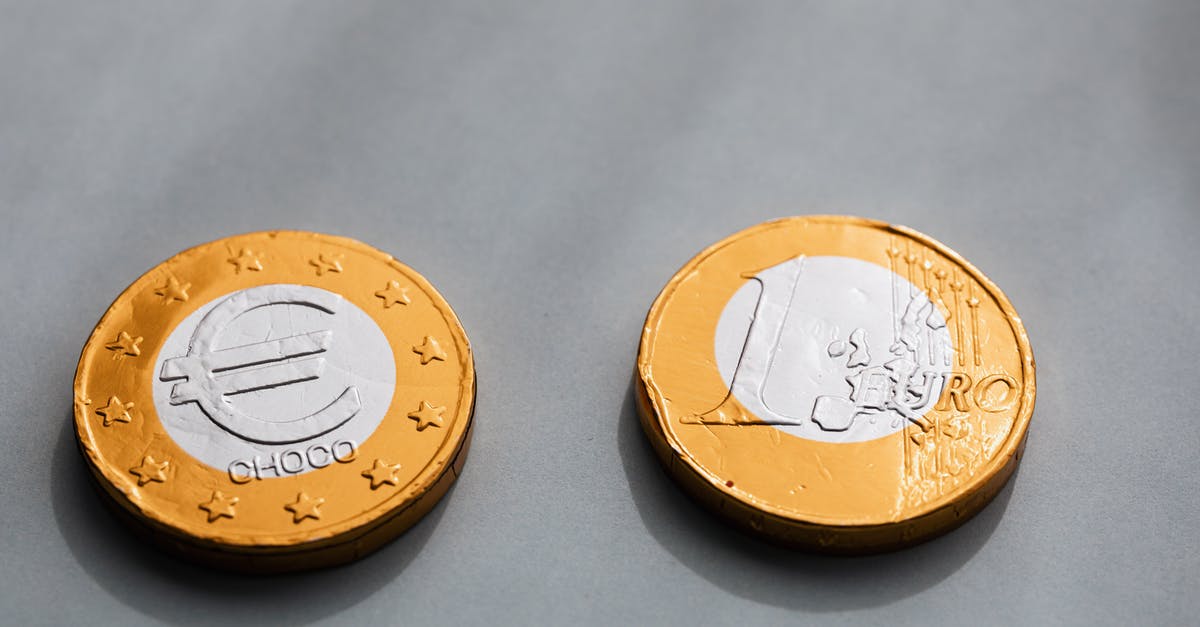 What's the value of the John Wick gold coins? - Coins one euros lying on gray table