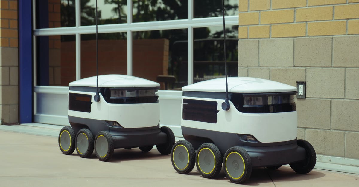 What are the implications of Emmet's autonomous movement? - Delivery Robots Parked Beside Building
