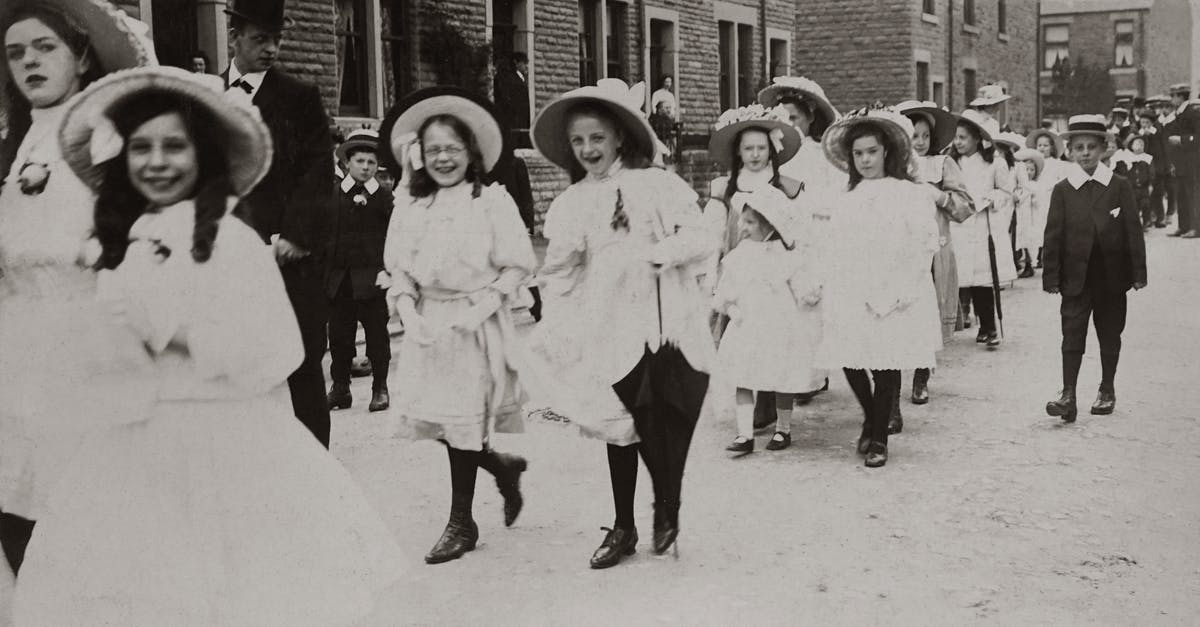 What did Mikael discover about the parade photos? - Procession Of Girls on the Street Wearing White Dresses With Hats