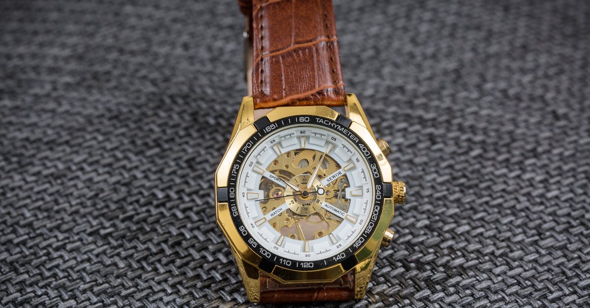 What did Q's hint that a watch tells time tell James but not me? - Elegant Brown Watch