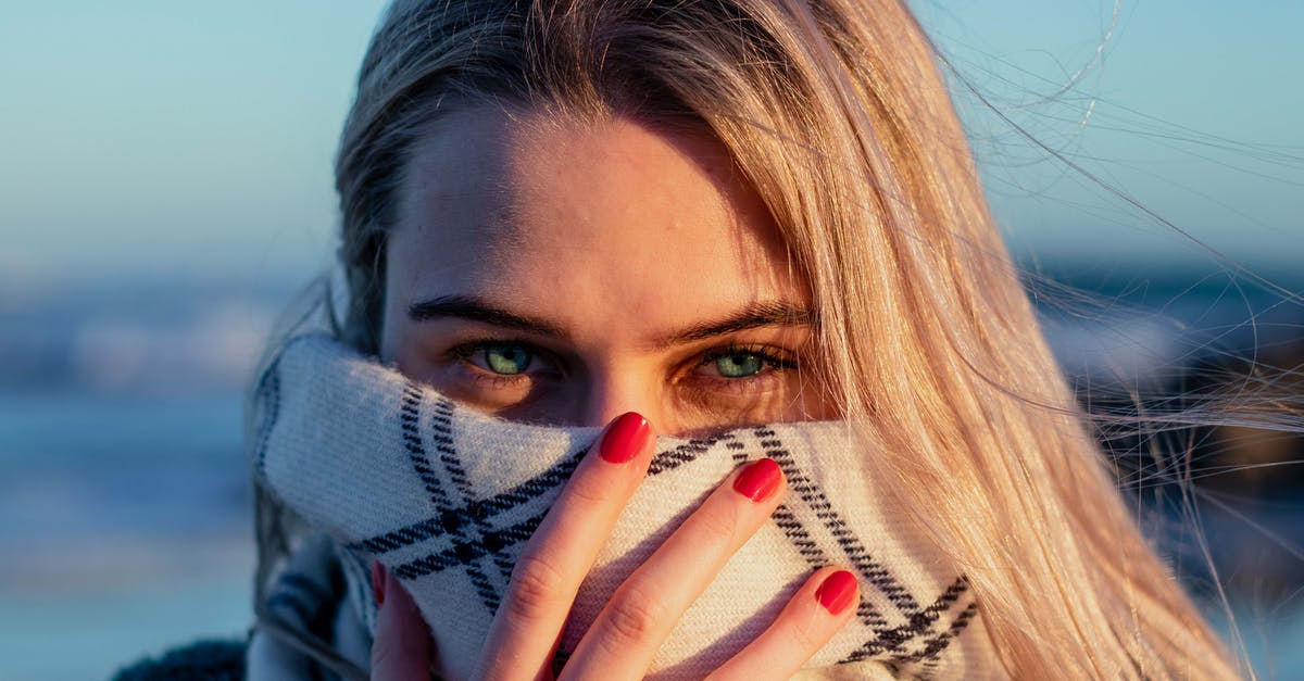 What do Green, Sarawat, and Mill find attractive about Tine? [closed] - Close-Up Photo of a Woman Covering Her Face With Scarf