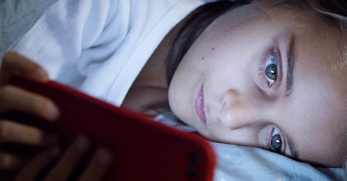 What do I need to know before watching 3D for the first time - Young Girl Lying While Using a Smartphone