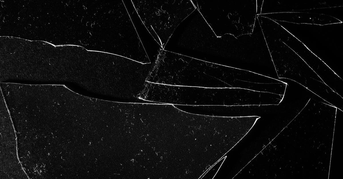 What do they use for broken glass pieces in movies? - Broken Clear Glass Pieces on Black Surface