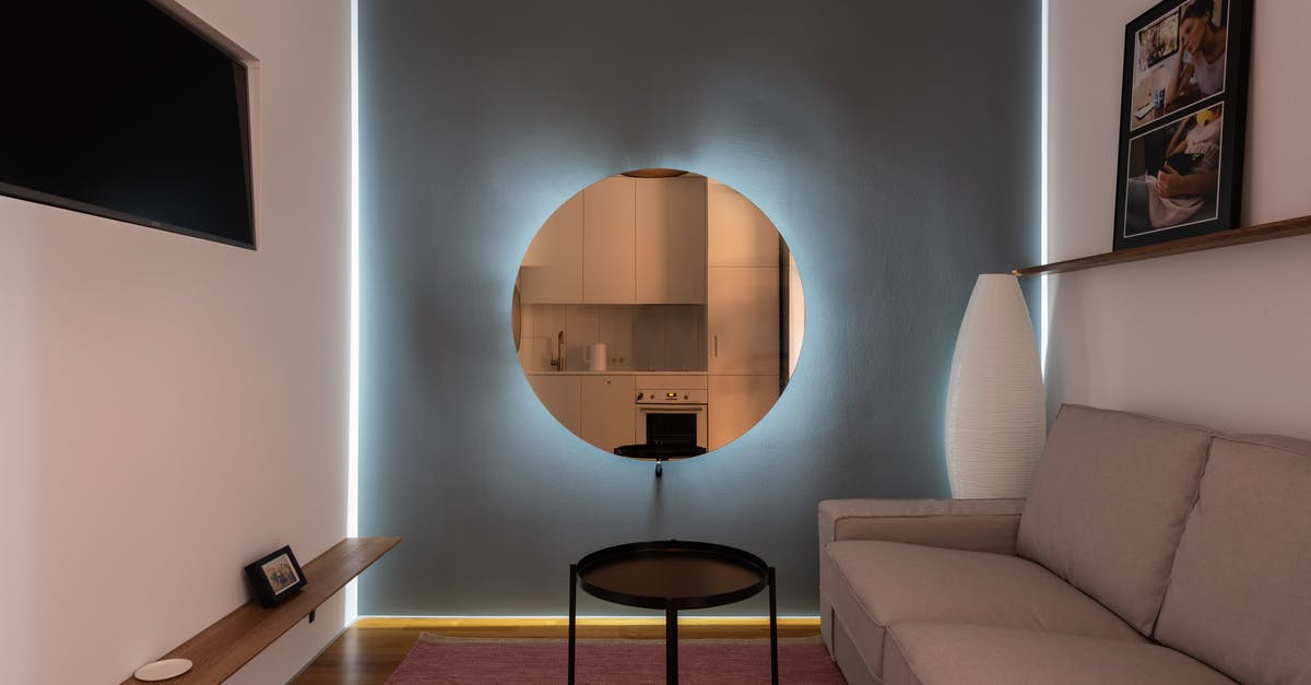 What does Allen's line about the floatation device mean? - Modern living room with illuminated mirror on wall