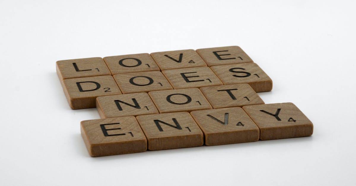 What does Eli mean with the words "Be me, for a little while"? - Close-Up Shot of Scrabble Tiles on a White Surface