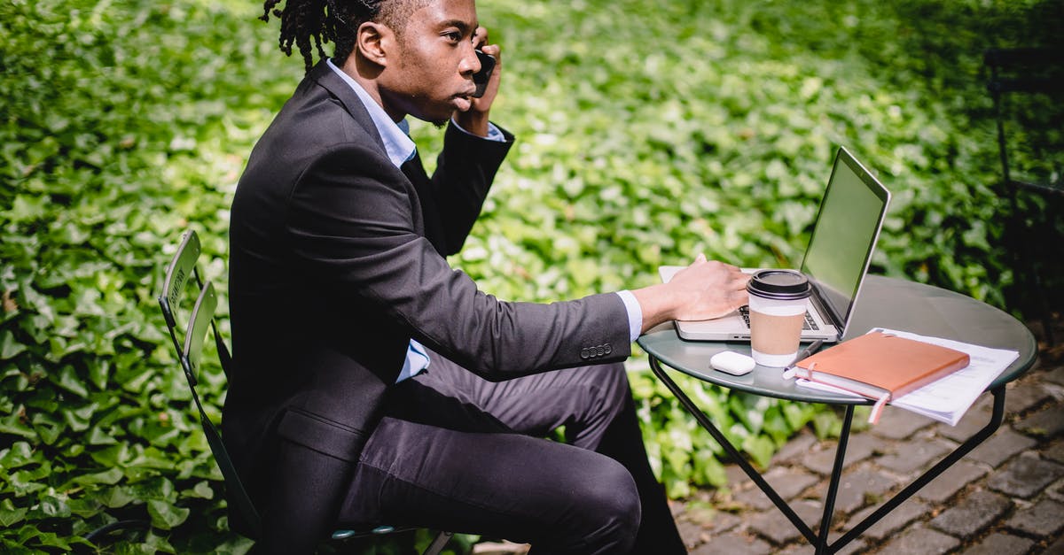 What does Paul Avery tell the coffee guy after the coffee guy calls him a "drunken reprobate"? - Serious African American male talking on smartphone while working on laptop in summer cafe