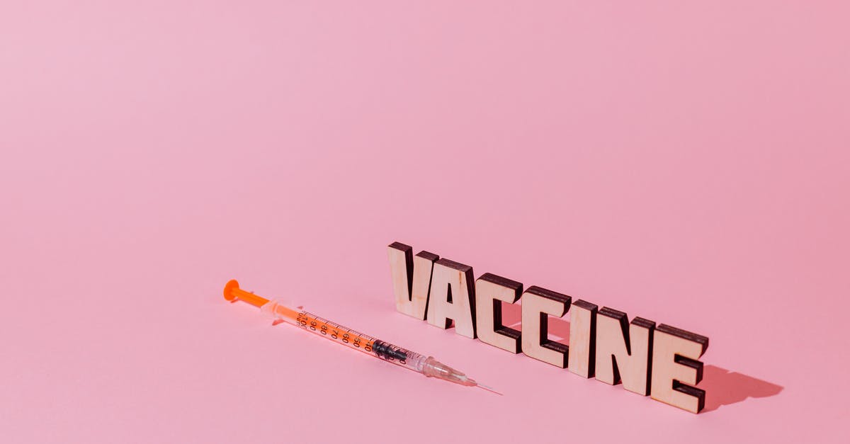 What does "A View to a Kill" mean? - A Syringe and Vaccine Lettering Text on Pink Background