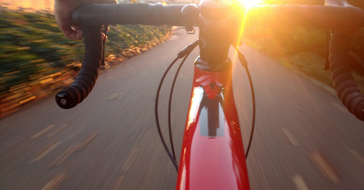 What does Sam Lombardo mean by "Never let the sun go down on an argument"? - Person Riding on Red Road Bike during Sunset