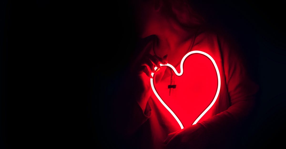 What does the color Red symbolize in "The Sixth Sense"? - Heart-shaped Red Neon Signage