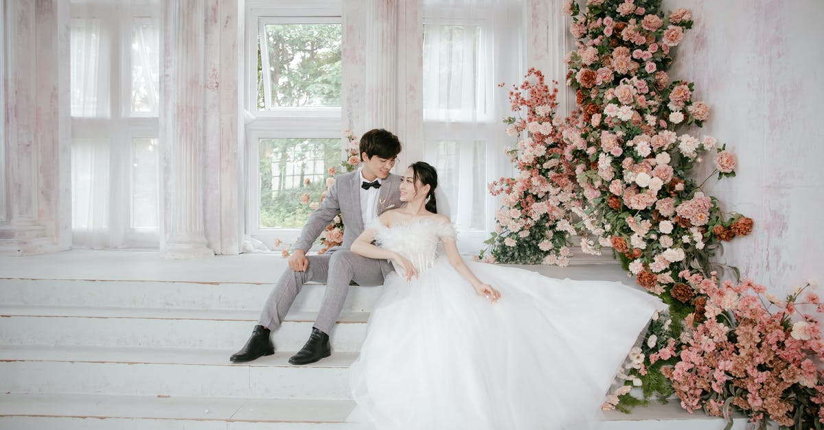 What happened in the end? Was it just a dream? - Man and Woman in Wedding Dress Standing Beside Red Flowers